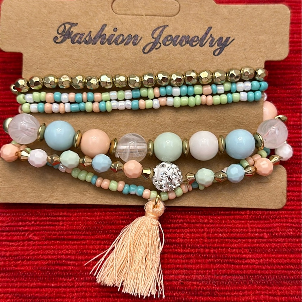 Set of 6 stretch beaded bracelets with tassel